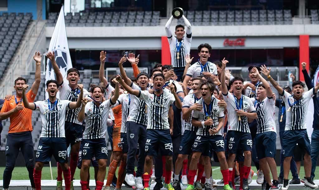 Rayados academy players celebrating together